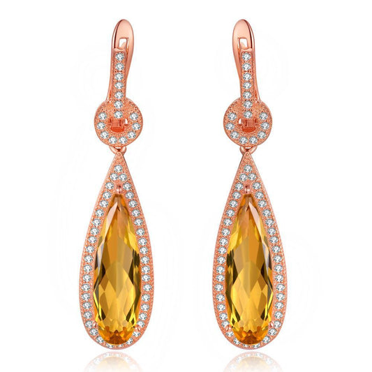 Close-up of Rosé Radiance Citrine Charm earrings by ELARÉ – pear-shaped citrine gemstone